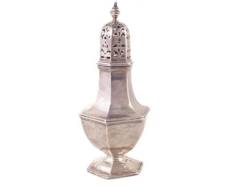 A late Victorian silver sugar caster, of hexagonal baluster form, with pierced foliate design and finial to the lid, with a s