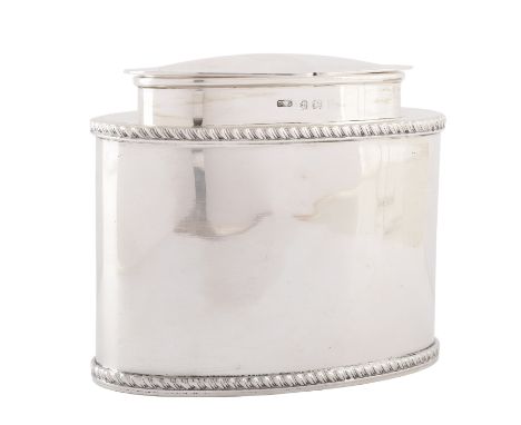 An Edwardian silver tea caddy, of oval shape, the straight body with gadrooning, and stepped top with a shaped hinged lid, ha