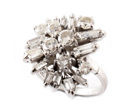 Diamond staggered cluster 18ct white gold ring, the staggered clawed set cluster comprising round brilliant and baguette cut 