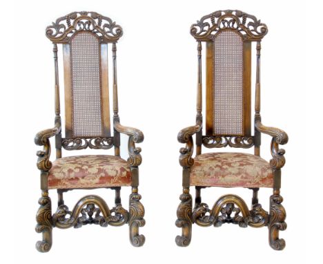Pair of 19th century Continental walnut framed open arm chairs, each with pierced and carved cresting rail, caned central bac
