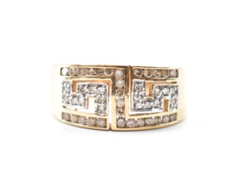 Hallmarked 9ct gold &amp; diamond band ring. The ring having pierced Greek key decoration. Hallmarked for Birmingham. Weighs 