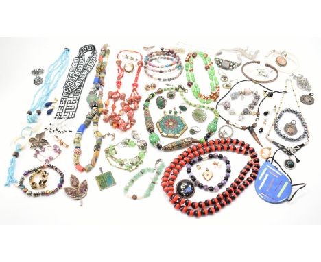 A collection of vintage costume jewellery. The lot to include a selection of vintage brooches, bangle bracelets, simulated pe