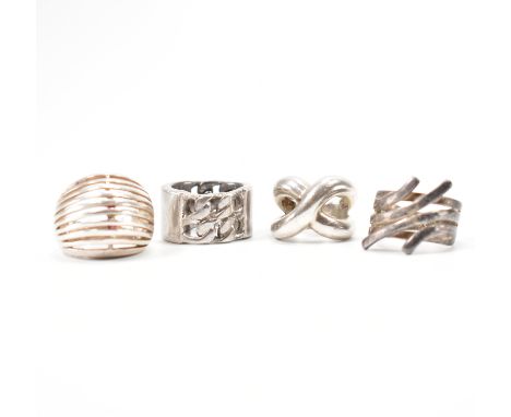 Collection of four silver rings. To include; Pianegonda, chain link, crossover, reeded &amp; pierced dome ring. Total weight 