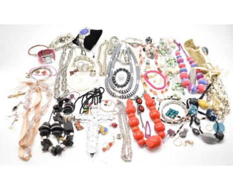 A collection of vintage costume jewellery to include beaded necklaces, bracelets, shell jewellery, wooden beads, loose earrin