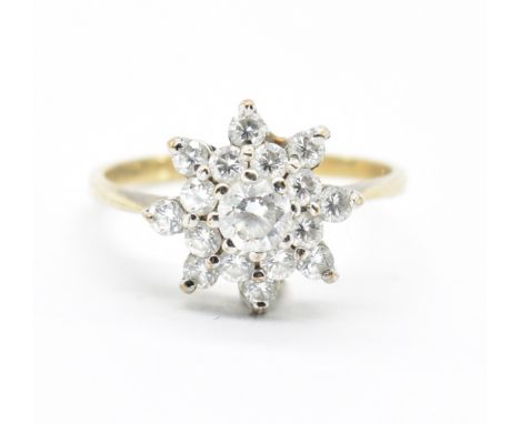 A hallmarked 9ct gold and CZ cluster ring. Hallmarked for London, date letter e, sponsors mark S&amp;K&nbsp; CZ. Total weight
