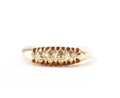 A hallmarked 18ct gold and&nbsp; diamond five stone ring. The ring set with five old cut diamonds to a pierced mount. Hallmar