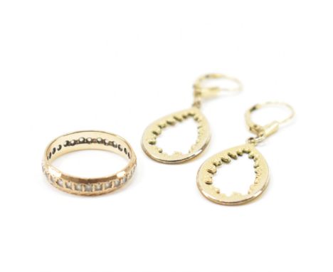 A group of gold jewellery. To include a pair of gold lever back teardrop earrings &amp; eternity ring having white stones to 