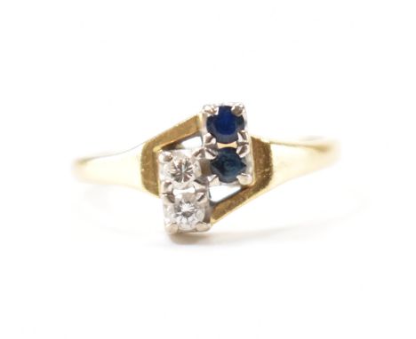 An Art Deco 18ct gold sapphire and diamond ring. The ring set with two round brilliant cut diamonds and two round mixed cut s