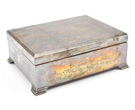 A vintage mid Century silver hallmarked desk top cigarette box. The box having engine turned details to the lid and engraved 