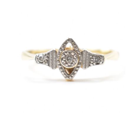 A 1920s Art Deco 18ct gold and platinum panel ring. The ring having a navette shaped head set with three diamond accents. Mar