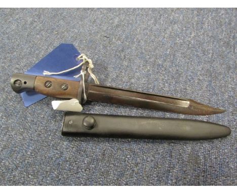 Bayonet: A British No5 bayonet for the Jungle Carbine, ricasso marked 'WSC' (Wilkinson Sword Company) in its steel scabbard. 