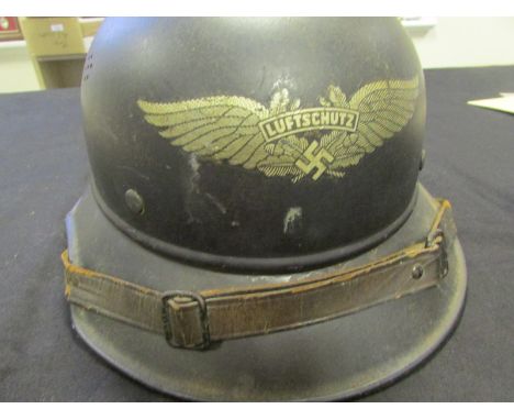 German WW2 Lufftscutz Civil Defence helmet with good decal on the front complete with lining and chin strap