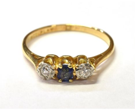 SAPPHIRE &amp; DIAMOND TRILOGY RING Central cushion cut 'cornflower' blue sapphire approx 0.18 carats, flanked by two platinu