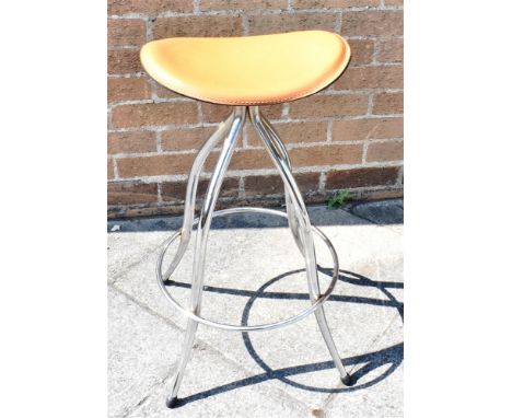 ARRBEN, ITALY:  a tan leather upholstered stool on chrome steel supports, stamped to underside 'ARRBEN/ ITALY REGISTERED MODE