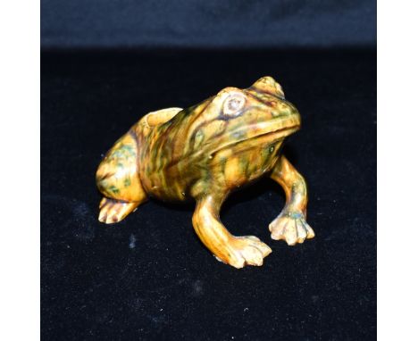 DUNMORE POTTERY, SCOTLAND: a spoonwarmer modelled as a seated toad, green/brown/yellow glaze, stamped 'DUNMORE' to underside,