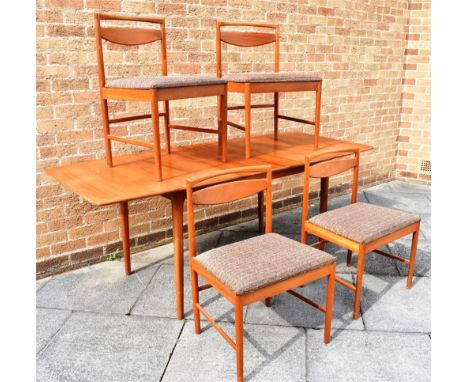 A.H. McINTOSH OF KIRCALDY:  a teak extending dining table, and set of four matching model 9433 dining chairs, the table 166cm