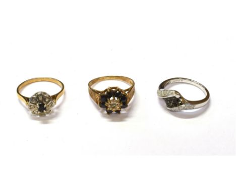 9CT GOLD SAPPHIRE &amp; DIAMOND SET RINGS To include one 10mm floral cluster, set with a dark blue round mixed cut sapphire e