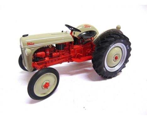 A 1/16 SCALE DANBURY MINT 1952 FORD 8N TRACTOR  grey and red, mint or near mint, boxed.