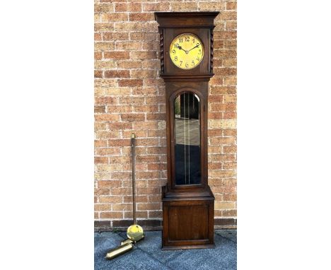 AN OAK CASED LONGCASE CLOCK  with 8-day Westminster chime movement, the hood with spiral turned pilasters, the trunk with gla