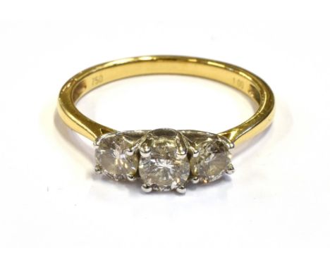 MODERN THREE STONE DIAMOND RING Central modern brilliant cut diamond approx 4.6mm flanked by two 4.3mm diamonds, assessed in 