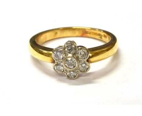 18CT GOLD &amp; DIAMOND FLORAL CLUSTER RING Set with seven round brilliant cut diamonds, est TDW 0.50 carats, with quality as