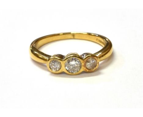 18CT GOLD AND DIAMOND TRILOGY RING Three round brilliant cut diamonds, chenier set, approx TDW 0.45 carats, quality assessed 