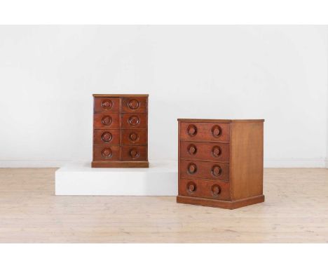 A pair of mahogany chemist's cabinets, 19th century, each square top with a reeded edge, above an arrangement of drawers with