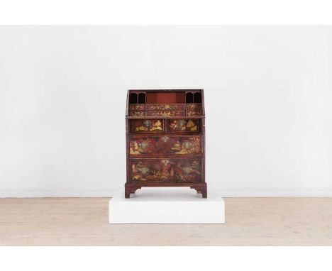 A George II red and gilt-japanned bureau, second quarter of the 18th century and later, with a fall front enclosing a fitted 