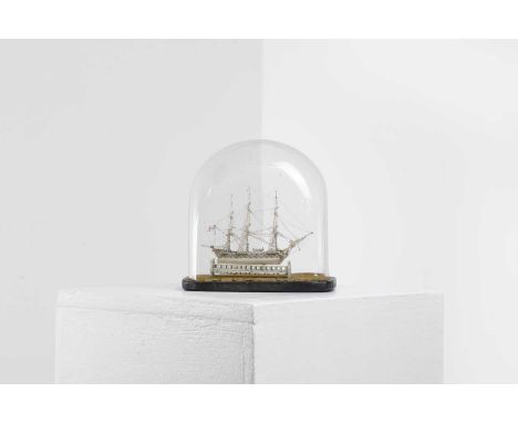 A Napoleonic bone prisoner-of-war ship model, early 19th century, the 5-inch long ship with three masts, a St George's flag, 