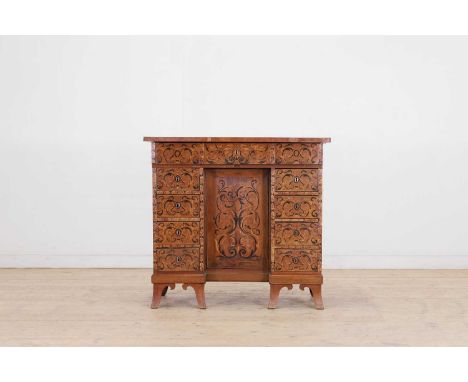 A walnut and seaweed marquetry bureau,  late 17th/early 18th century and later, Continental, with a hinged top and fall, reve