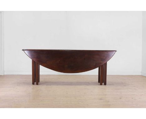 A George III mahogany wake table, second half of the 18th century and later, the folding oval top raised on square supports,2