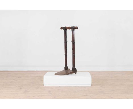 A Regency mahogany bootjack, early 19th century, with turned detail,39cm wide 37cm deep 76cm highProvenance: The collection o