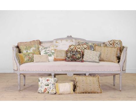 A collection of scatter cushions, including two crewelwork-style examples, two Bargello, as well as needlepoint, paisley and 