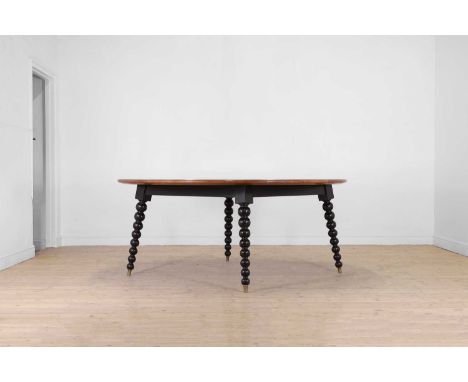 A large ash and ebony-inlaid centre table by Chester Jones, of recent manufacture, the circular top with geometric stringing,