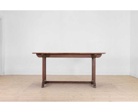 An Arts and Crafts oak side table, late 19th/early 20th century, with a rectangular top, raised on chamfered square supports 