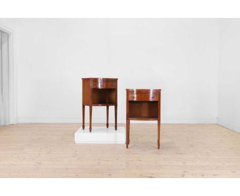 A pair of George III mahogany and boxwood strung bedside tables, c.1790, of bow-fronted outline, each top above a candle slid