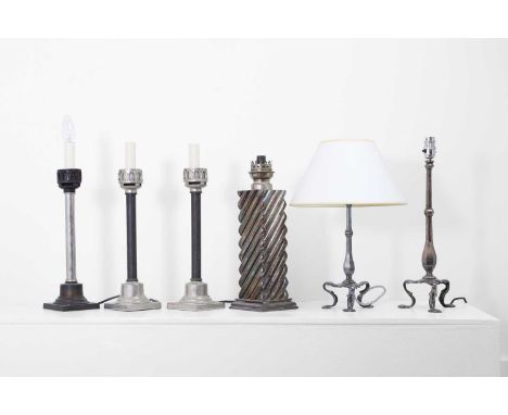 A collection of silvered-metal oil and table lamps, 19th century and later, comprising:a square example with twist decoration