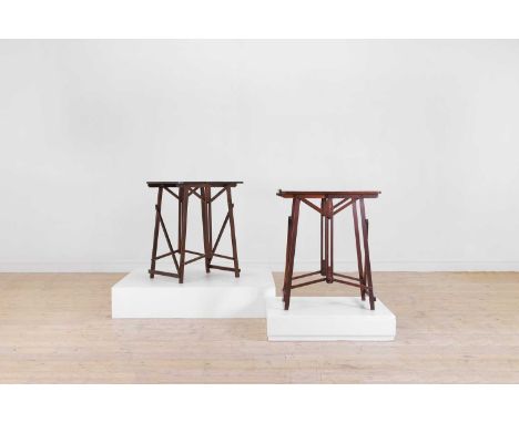 A near pair of teak folding campaign tables, early 20th century, each with slender square supports united by stretchers, larg