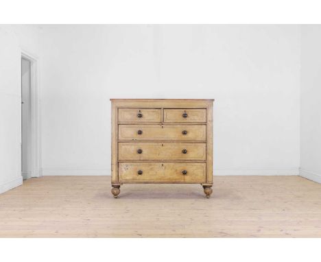 A scumbled pine chest of drawers, 19th century, the rectangular top above two short and three long drawers, raised on bun fee