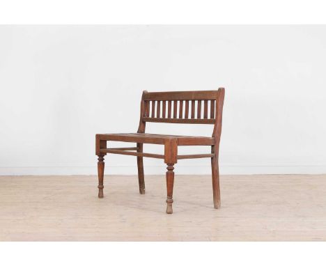 A Victorian oak hall bench, c.1880, with a slatted back and seat raised on ring-turned supports,108cm wide 52cm deep 91cm hig