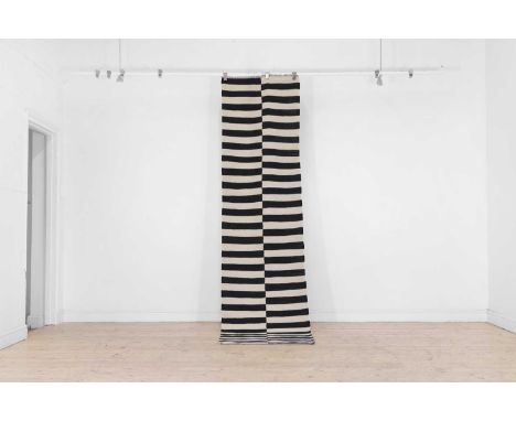 A modernist flat-weave wool runner, of recent manufacture, woven with alternating black and white stripes, 301 x 76cmConditio