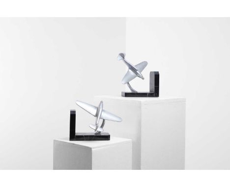 A pair of Art Deco chrome and marble bookends, c.1930, each in the form of an aeroplane, on a veined marble base, 20cm wide12