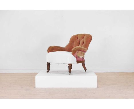 A late Victorian walnut tub chair by Gillows, c.1880, with a button-upholstered back and arms, raised on beaded and fluted tu