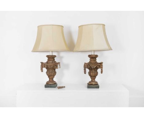 A pair of neoclassical giltwood table lamps, 19th century, Italian, each with Greek key motifs and laurel leaf garlands, with