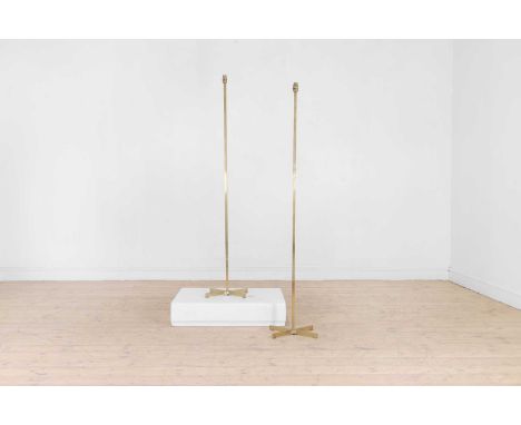 A pair of gilt-metal standard lamps, 20th century, each with a plain stem and crossed support,37cm diameter145cm high (2)Cond