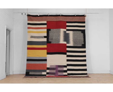 A Bauhaus-inspired flat-weave wool carpet, of recent manufacture, woven in polychrome colours with various stripes, 304 x 252
