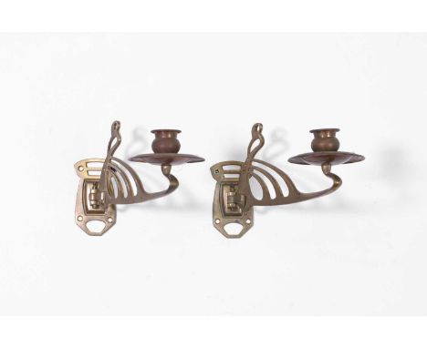 A pair of Art Nouveau brass wall sconces, c.1900, each of scrolling form,21cm long7cm wide13cm high (2)Provenance: The collec