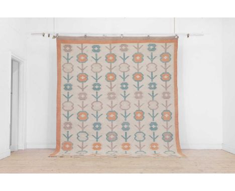 A Colefax and Fowler-inspired flat-weave wool carpet, of recent manufacture, woven in tones of green, red and brown with popp
