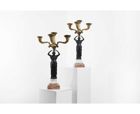 A pair of Empire-style gilt and patinated bronze five-light candelabra, c.1860, French, each in the form of a caryatid holdin