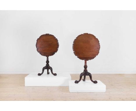 A pair of George II-style mahogany tripod occasional tables, late 19th/early 20th century, each pie-crust top above a turned 